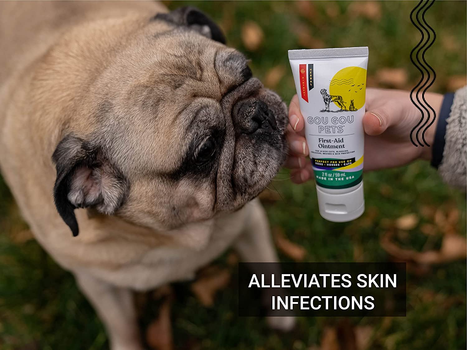 Pug dog with a tube of 'Bob Gou Pets' First Aid Cream in a hand, with text 'Alleviates Skin Infections'.