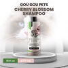 Gou Gou Pets Cherry Blossom Shampoo 16fl oz cat in background.